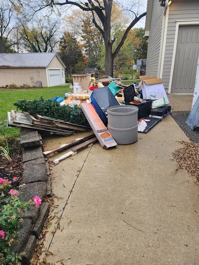 Dumpster being loaded with debris for Commercial Dumpster Rental in Milan